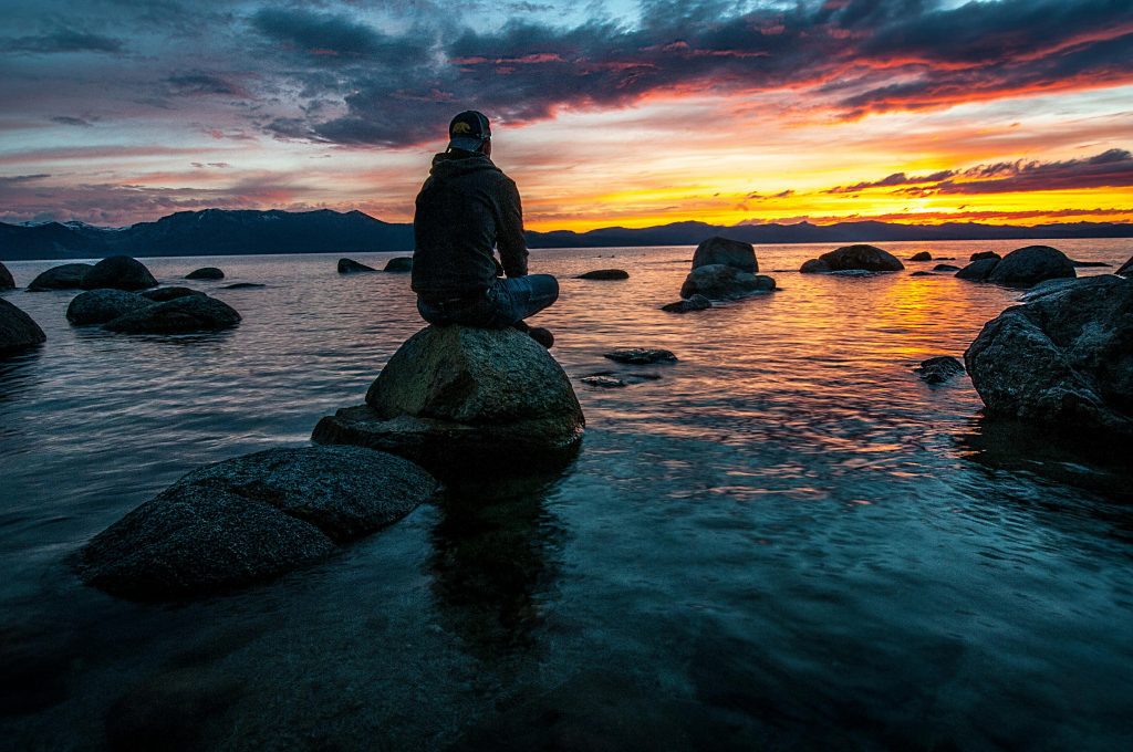 How To Self-Regulate Like a Pro: Emotional Intelligence 101 1 man sitting calmly